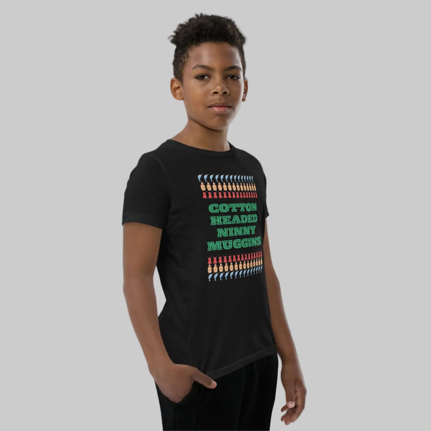 Kids holiday shirt with the iconic “Cotton Headed Ninny Muggins” quote from Elf, printed on a soft, breathable youth short sleeve tee. Designed with a relaxed unisex fit and durable pre-shrunk fabric, this Christmas t-shirt is perfect for festive fun, holiday events, and everyday winter wear. An excellent gift for young Elf fans and holiday enthusiasts.