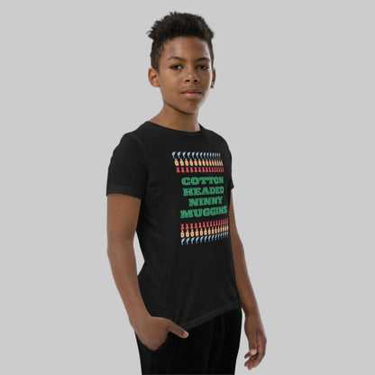 Kids holiday shirt with the iconic “Cotton Headed Ninny Muggins” quote from Elf, printed on a soft, breathable youth short sleeve tee. Designed with a relaxed unisex fit and durable pre-shrunk fabric, this Christmas t-shirt is perfect for festive fun, holiday events, and everyday winter wear. An excellent gift for young Elf fans and holiday enthusiasts.