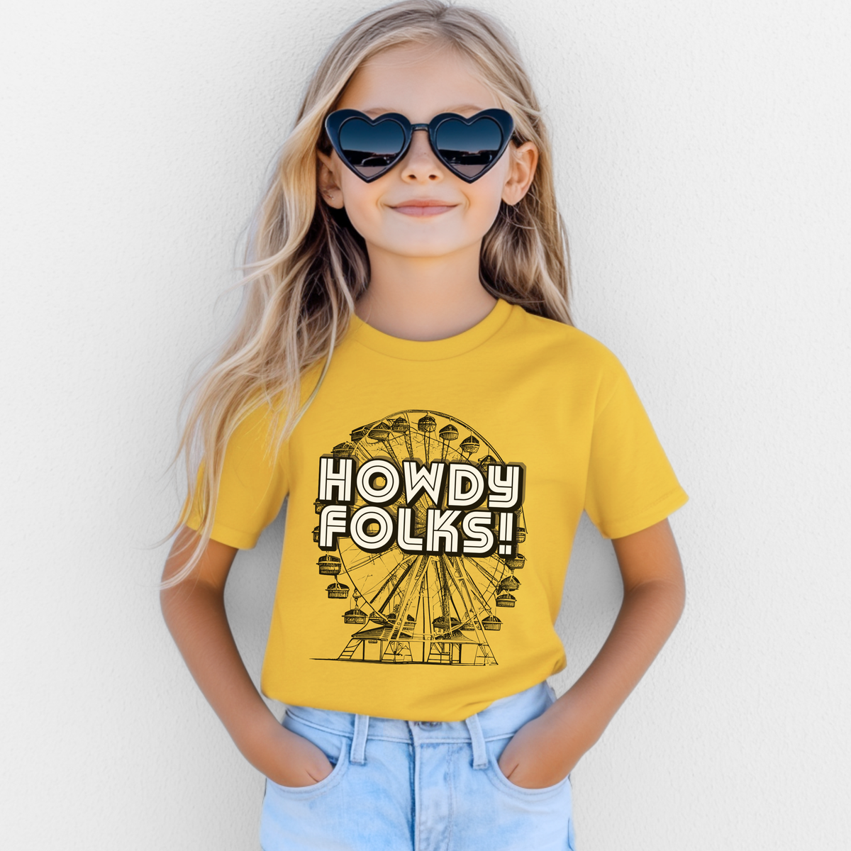 Kids State Fair shirt featuring a vintage Ferris wheel and large HOWDY FOLKS lettering with a nostalgic carnival inspired look. This youth graphic tee is made for little fair fans heading to the State Fair of Texas, county fairs, festivals, and family outings. A fun choice for fair day outfits and family photos, with a coordinating adult Howdy Folks shirt available for matching looks.