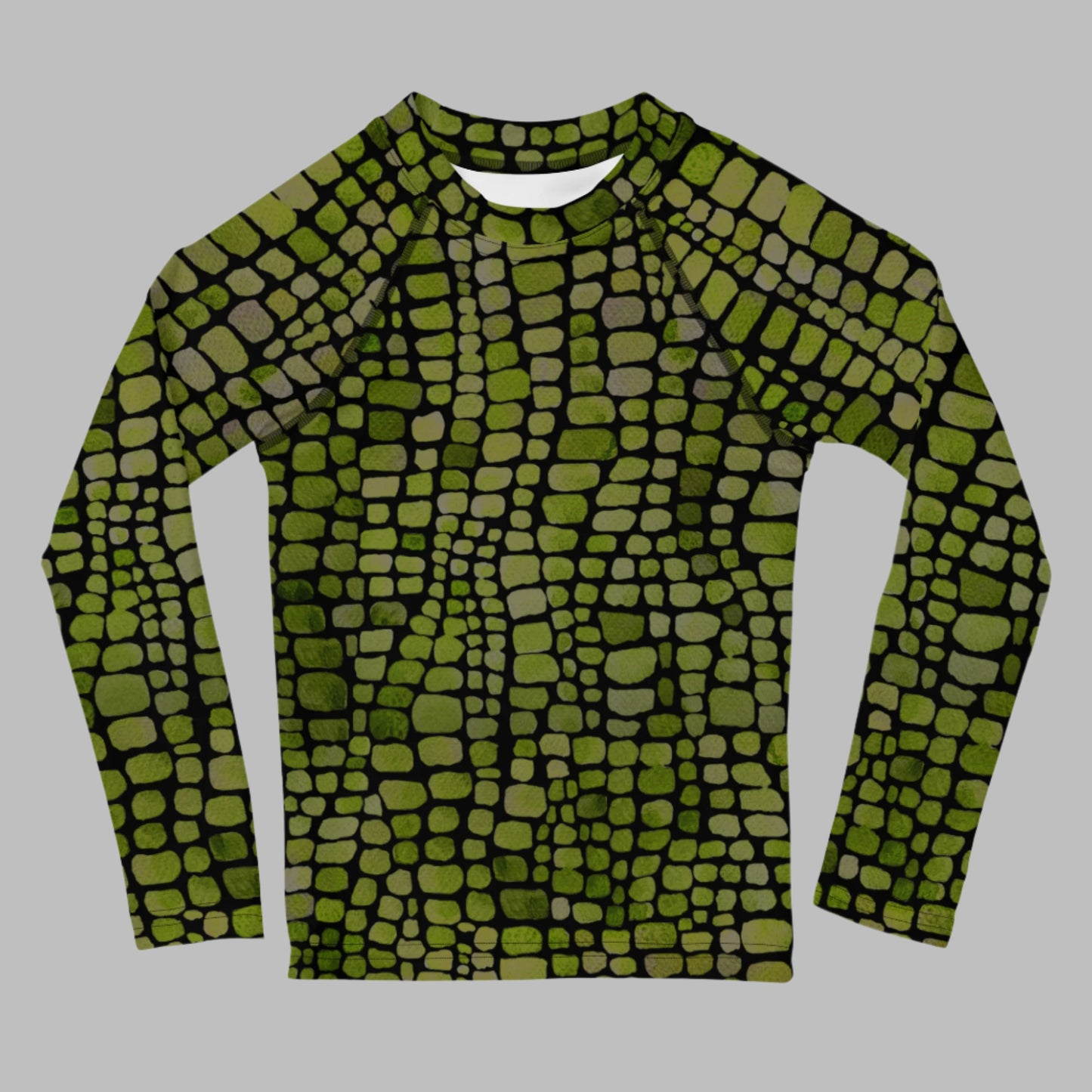 Kids rash guard with green reptile scales, perfect for toddlers in sizes 2T–7. This long sleeve swim shirt is great for water play, beach fun, and animal costume adventures. Use it for dinosaur or lizard dress-up or as part of a unique swim outfit. Lightweight and protective, it’s a favorite for parents who want UV safety and kids who love reptiles.