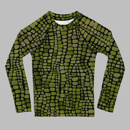 Kids rash guard with green reptile scales, perfect for toddlers in sizes 2T–7. This long sleeve swim shirt is great for water play, beach fun, and animal costume adventures. Use it for dinosaur or lizard dress-up or as part of a unique swim outfit. Lightweight and protective, it’s a favorite for parents who want UV safety and kids who love reptiles.
