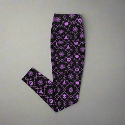 Wickedly Cute Ladies Halloween Leggings, featuring a black material with a purple geometric pattern that consists of spiders webs, pumpkns, witches hats and skulls, by jaecrece.com