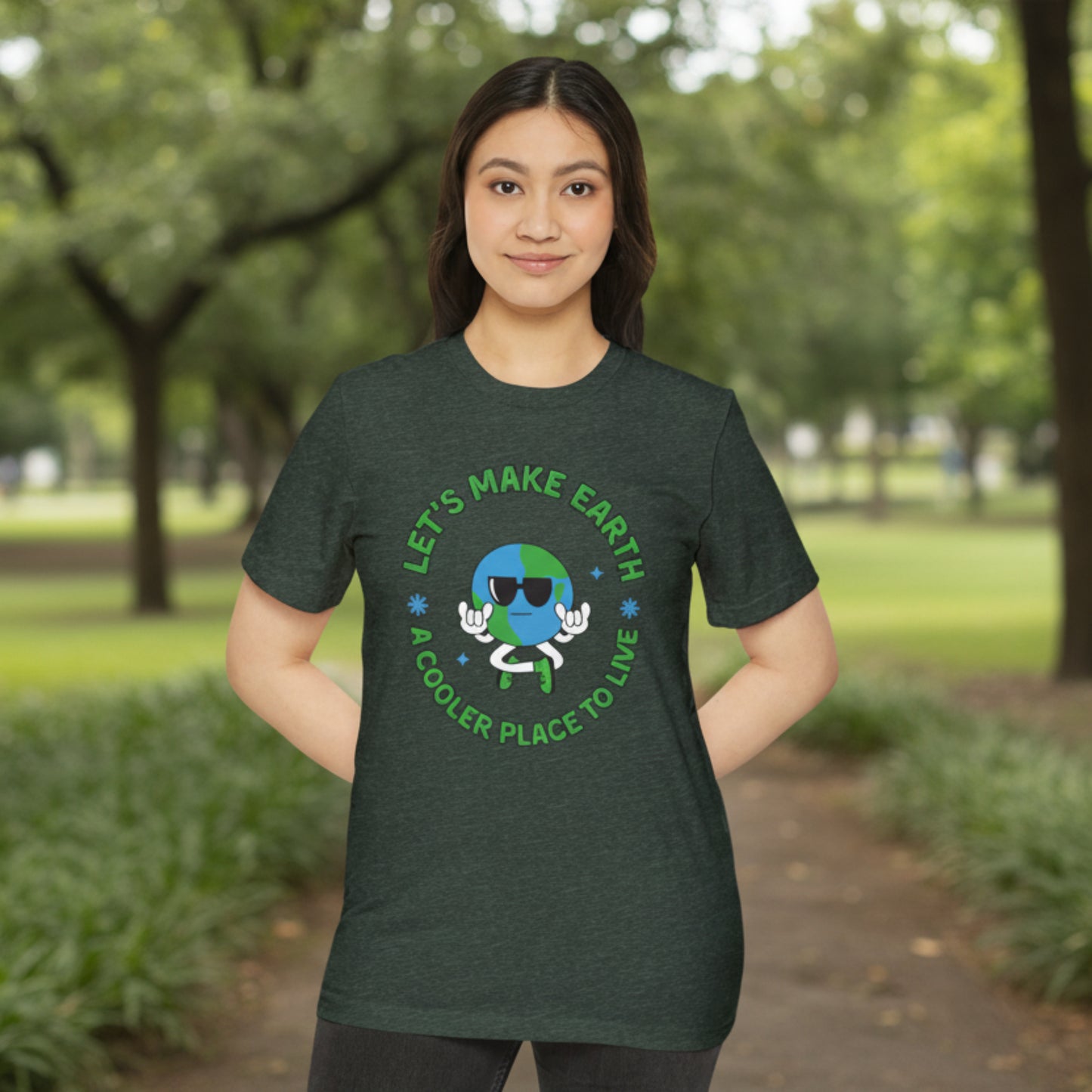 Model wearing unisex "Let's Make Earth a Cooler Place to Live" recycled organic t shirt in several colors, showing lightweight, comfortable fabric, eco friendly materials, and sustainable fashion style for environmental awareness and daily casual wear.