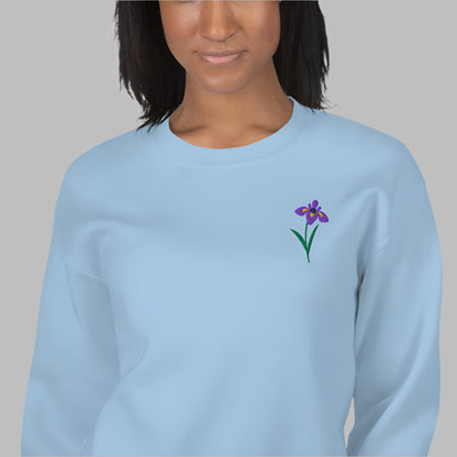 Image: A beautifully embroidered iris flower crewneck sweatshirt in a soft, relaxed fit. This custom floral design adds an elegant touch to any wardrobe, making it a meaningful Mother's Day gift or a thoughtful present for nature lovers. The intricate embroidery captures the essence of the bearded iris, creating a timeless piece that celebrates botanical beauty and personal style, by jaecrece.