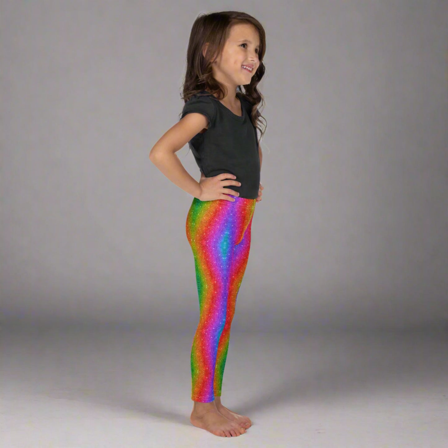 These toddler girls’ rainbow glitter leggings in sizes 2T–7 are designed with a holographic swirl pattern that mimics glittery shine—perfect for family Pride outfits, Mardi Gras celebrations, or colorful 5K events. Made from soft microfiber with four-way stretch, they offer comfort, flexibility, and fun for every energetic little one. A bold fashion piece for playful days.