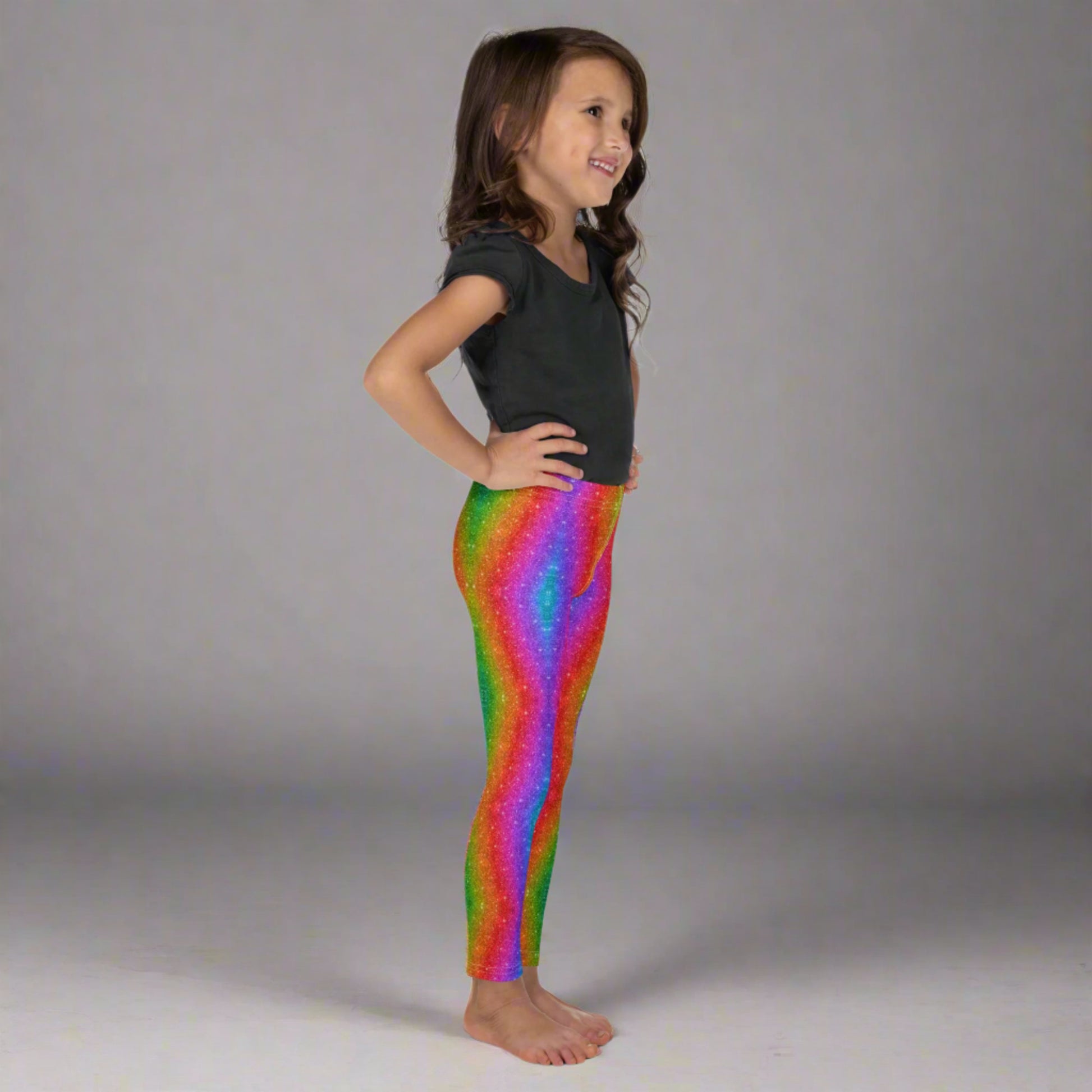 These toddler girls’ rainbow glitter leggings in sizes 2T–7 are designed with a holographic swirl pattern that mimics glittery shine—perfect for family Pride outfits, Mardi Gras celebrations, or colorful 5K events. Made from soft microfiber with four-way stretch, they offer comfort, flexibility, and fun for every energetic little one. A bold fashion piece for playful days.
