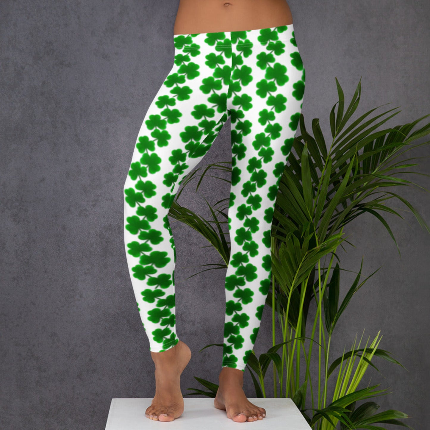 Image: Lucky Four Leaf Clover Leggings for toddler girls, tween, teens and women.With their festive green shamrock chains on a white base, these mid-rise women’s leggings are perfect for Irish celebrations. Made with comfortable, flexible fabric and full-length legs, they’re great for moms celebrating St. Patrick’s Day in style. Whether you’re attending a parade or just relaxing at home, these leggings bring fun and flair to your holiday wardrobe.