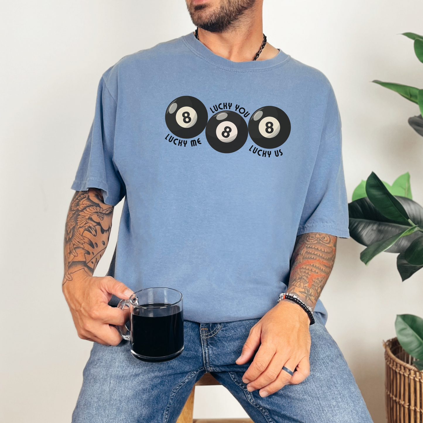 Comfort Colors Blue Jean t shirt featuring Lucky Me Lucky You Lucky Us phrase and three retro 8 balls in clean black print. Relaxed unisex graphic tee made from soft ring spun cotton with garment dyed finish for vintage appeal. Perfect anniversary gift, boyfriend gift, girlfriend gift, newlywed shirt, matching pair tee, or stylish casual outfit piece. Popular aesthetic shirt for shoppers who love nostalgic graphics and premium basics.