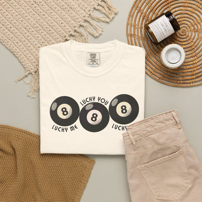 Comfort Colors Lucky Me Lucky You Lucky Us shirt in Ivory featuring three retro 8 ball graphics with curved black text. Soft garment dyed unisex tee with vintage inspired style and relaxed fit. Trendy couples shirt for anniversaries, weddings, Valentine gifts, honeymoon outfits, matching photos, or casual everyday wear. Premium cotton graphic tee styled for modern streetwear lovers who want nostalgic fashion with playful lucky vibes and year round comfort.