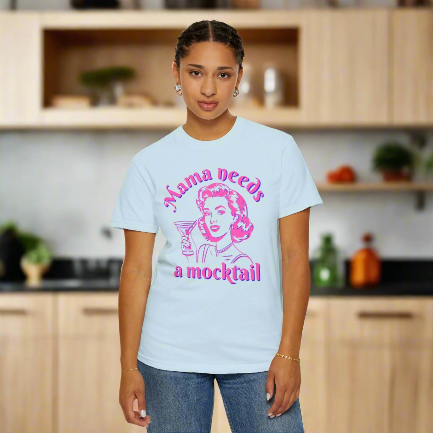 Image: This retro pop art Mama Needs a Mocktail tee combines humor and style with a hot pink neon design of a vintage mom holding a cocktail glass. Printed on soft Comfort Colors fabric in six stylish shades, this shirt makes a fun gift for expecting mothers, sober curious friends, or those celebrating their recovery journey. A perfect way to show support for mindful drinking choices, by jaecrece.
