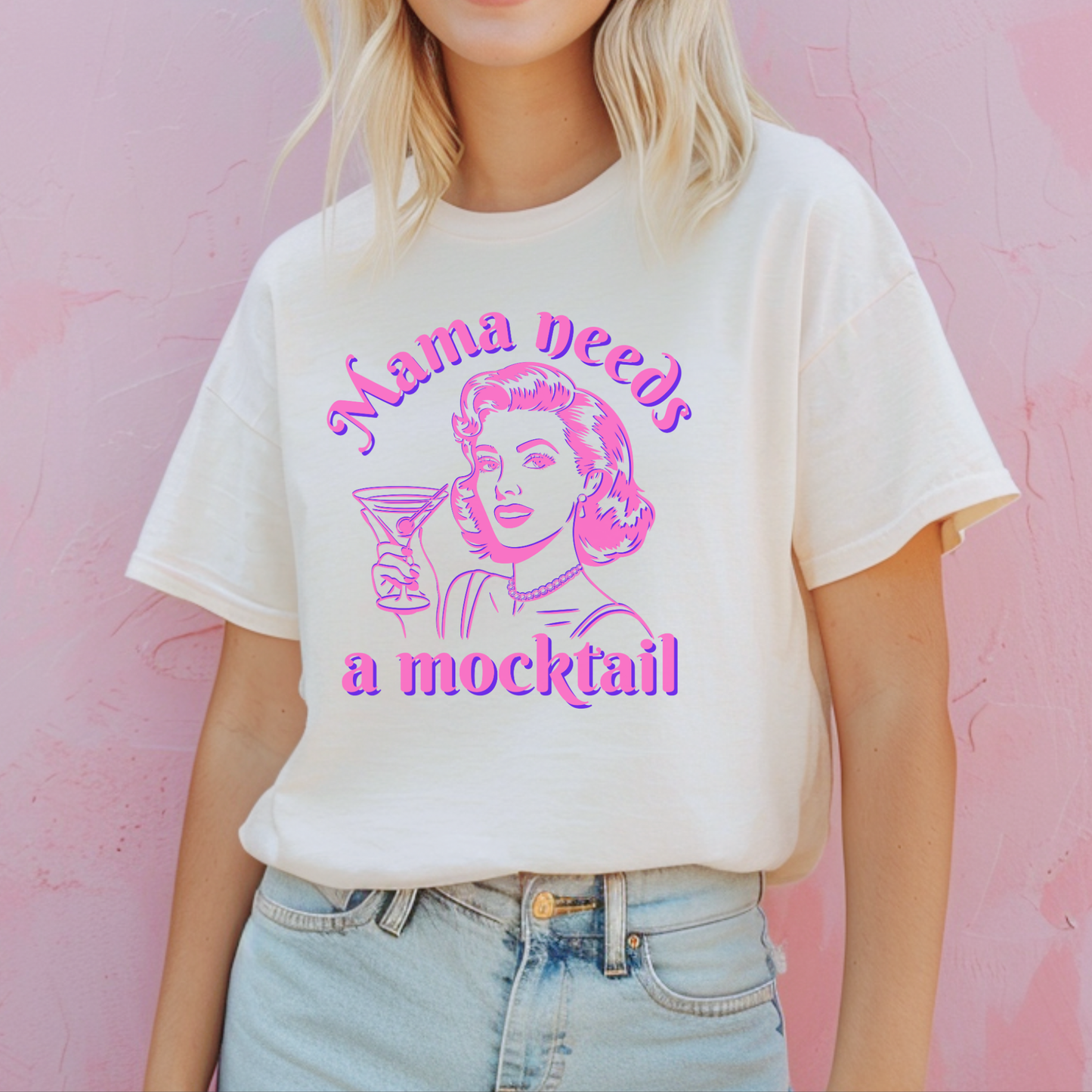 Image: Mama Needs a Mocktail t-shirt in six trendy shades, featuring a bold hot pink neon graphic of a pop art style mom raising a cocktail glass. This Comfort Colors tee is a fun and supportive gift for anyone on a sobriety journey, a newly pregnant mom, or someone celebrating a soberversary. Perfect for casual outings, mocktail parties, or just a lighthearted statement about cutting back on alcohol, by jaecrece.