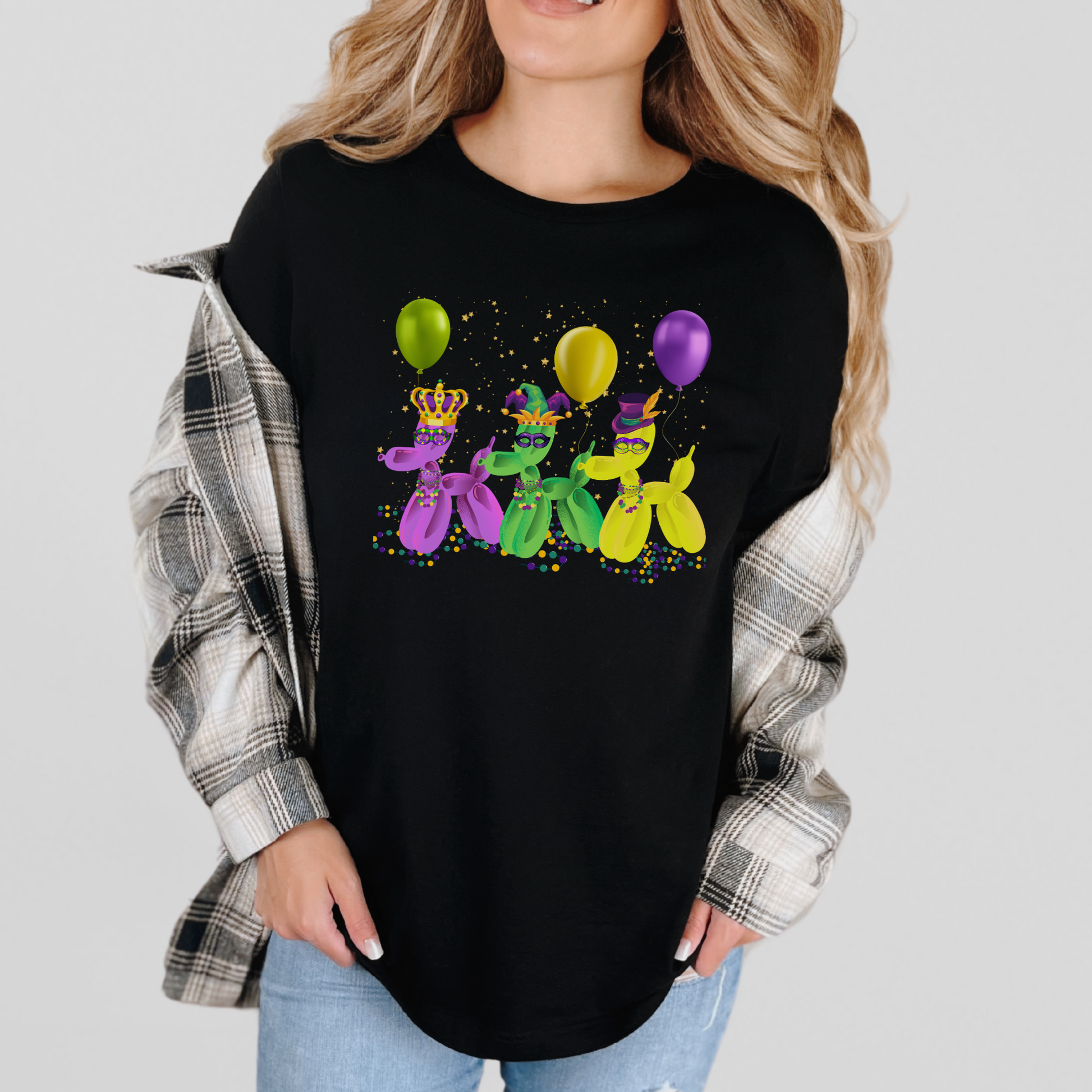 Show your love for New Orleans with this Mardi Gras-themed balloon dog shirt in classic black. Designed for festive fun, this tee includes green, purple, and gold balloon dogs dancing in confetti. Available in sizes XS–5XL, it’s a perfect French Quarter-inspired piece for Carnival season, Fat Tuesday events, and NOLA parties. Ideal for parade-goers and balloon art lovers alike.
