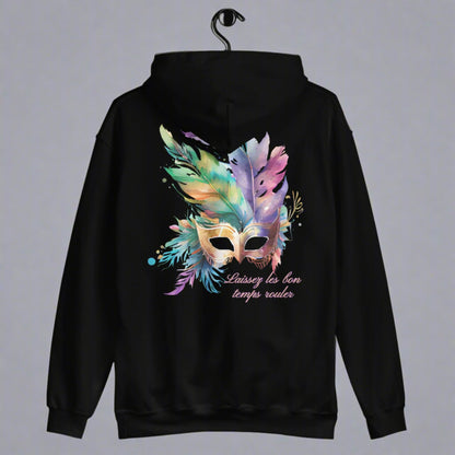 Image: Black Adult Mardi Gras Hoodie, printed on front and back. The front of the sweatshirt has a watercolor carnival mask, and the back features an oversized graphic of the same party mask with the text Laissez les on temps rouler, by jaecrece