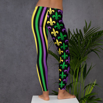 Alt text: Mardi Gras leggings for women. Featuring a black background, one leg has bold gold, green, and purple stripes, while the other showcases a fleur-de-lis pattern. Perfect for celebrating New Orleans style with festive flair.