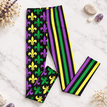 Alt text: "Mardi Gras Stripes and Fleur de Lis Youth Leggings, size 8-20. Black leggings with a fleur de lis pattern on one leg and bright green, purple, and yellow stripes on the other. Elastic, soft, and durable with vibrant colors. Part of a matching collection for younger children and women, each pair is precision-cut and hand-sewn for a perfect fit."