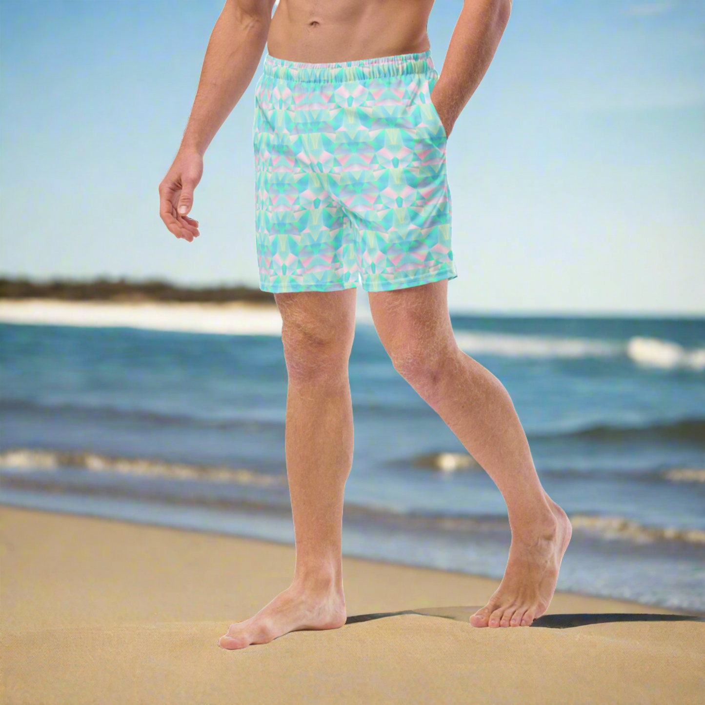 Person wearing colorful swim shorts on a beach