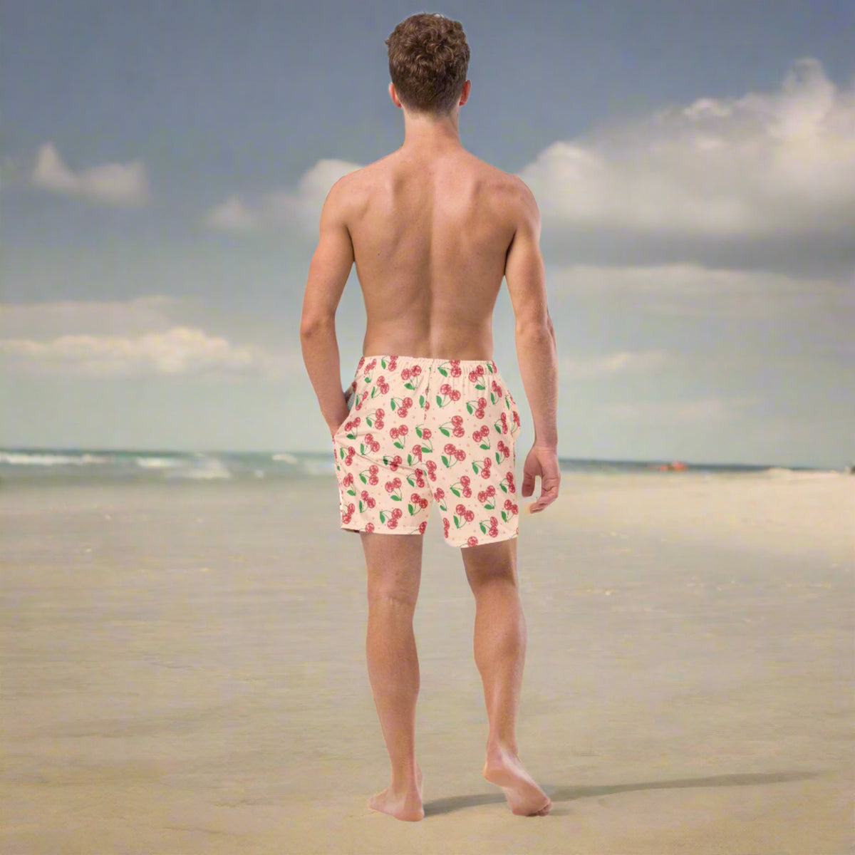 Men’s disco cherries swim boxers in sizes 2XS through 6XL with regular and plus size options. This retro fruit print swimwear features red disco ball cherries and stars on a pink background, perfect for men’s beachwear, summer swim trunks, pool parties, vacations, cruises, tropical getaways, and matching family swimwear from JaeCrece.