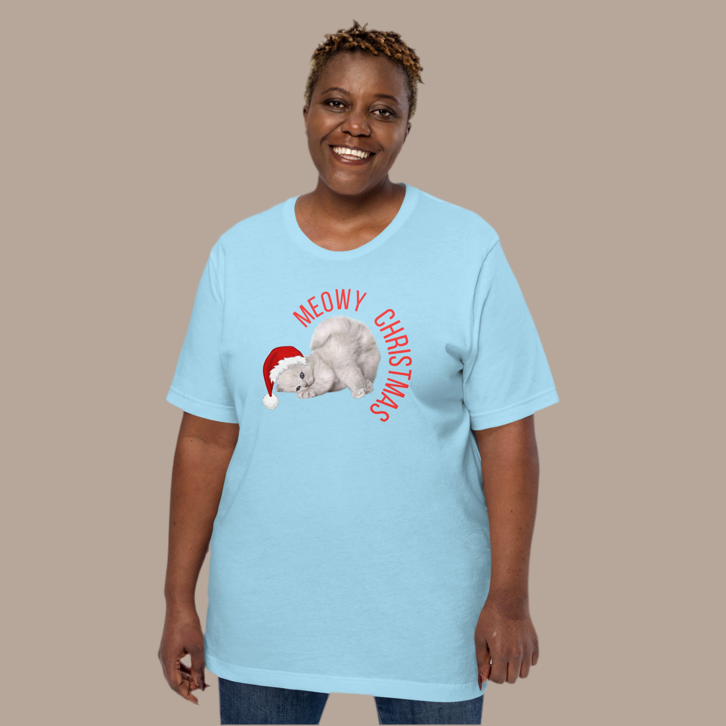 This Meowy Christmas adult t-shirt brings the purr-fect amount of holiday humor with a festive grey kitten in a Santa hat and the phrase “Meowy Christmas” across the chest. Designed for men and women in sizes XS–5XL, it’s soft, comfy, and part of a matching family Christmas set with kids’ tees, sweatshirts, and blankets. Great for cat lovers, Christmas parties, or silly photo ops. A fun and cozy holiday gift idea.