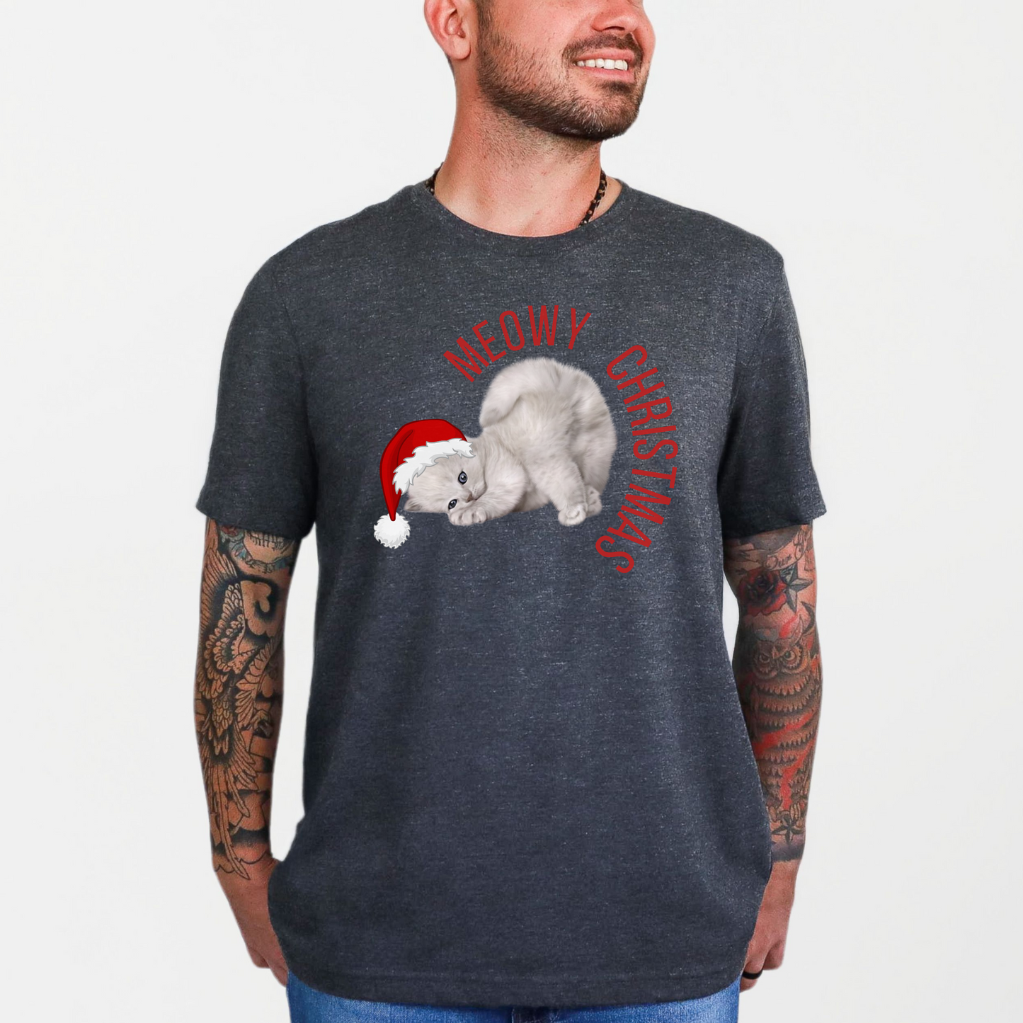 Show off your love for cats and Christmas with this Meowy Christmas unisex t-shirt featuring a cute grey kitten in a Santa hat. With “Meowy Christmas” printed across the chest, this festive tee is perfect for holiday gatherings, family photos, or cozy nights at home. Available in adult sizes XS–5XL and part of a matching family collection that includes youth apparel and blankets for coordinated cheer.