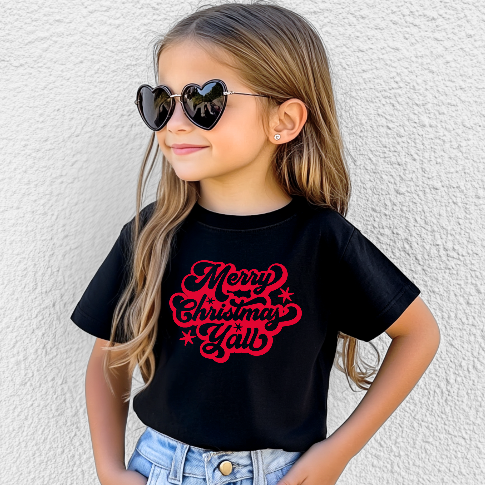This kids’ holiday shirt features a cheerful “Merry Christmas Y’all” design in bright red script, bringing Southern charm to your little one's holiday wardrobe. Made from soft ring-spun cotton and pre-shrunk for a great fit, it’s ideal for school parties, family photos, and cozy winter days. A perfect part of your matching family Christmas outfit—available in youth, toddler, and adult sizes.