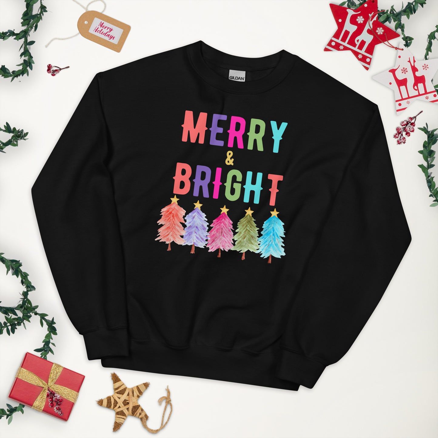 Stay festive and comfortable with our Merry and Bright sweatshirt designed on the premium Gildan 18000. Featuring a playful holiday tree design and bold lettering, this cozy crewneck is available in white, navy, and black in sizes S through 5XL. Perfect for plus size holiday fashion, this unisex Christmas sweatshirt makes a great outfit for holiday parties, family photos, or as a cheerful Christmas gift for friends and loved ones.