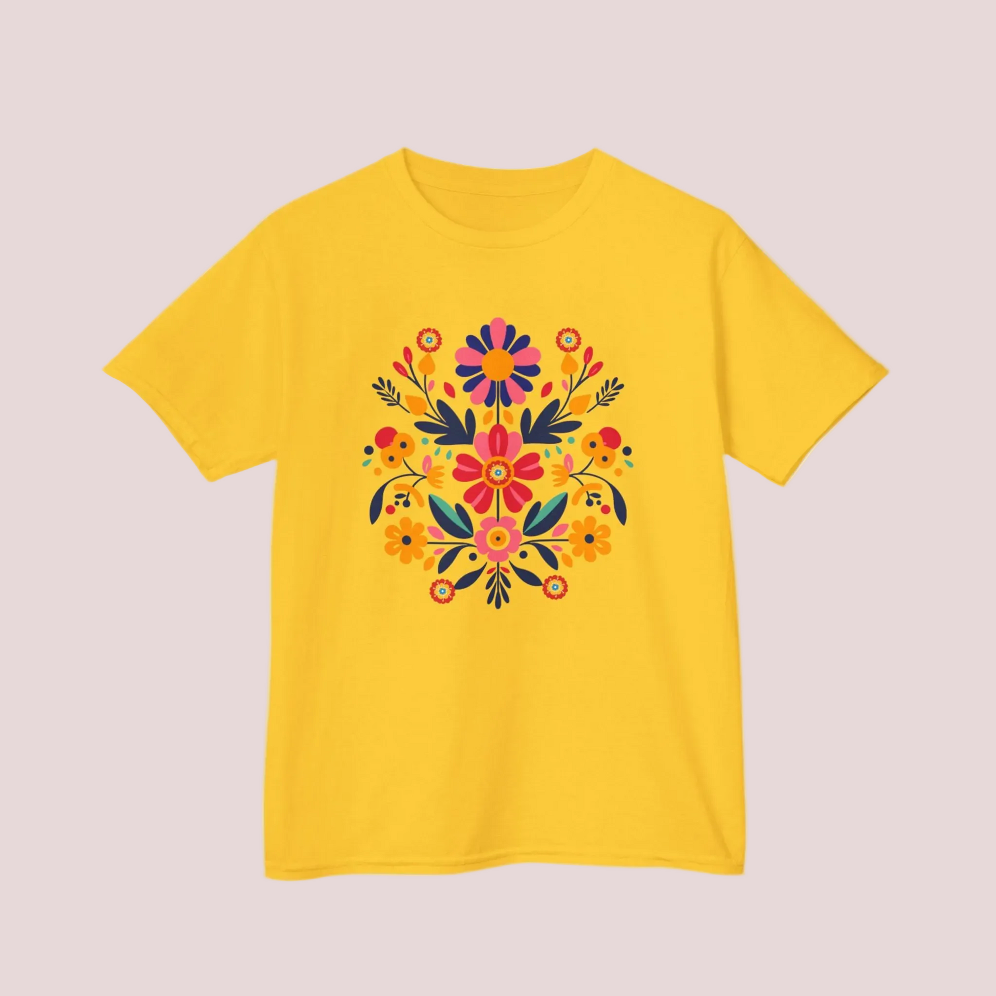 Yellow t-shirt with a colorful Mexican folk art floral Otomi design on a light background 