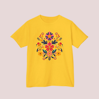 Yellow t-shirt with a colorful Mexican folk art floral Otomi design on a light background 