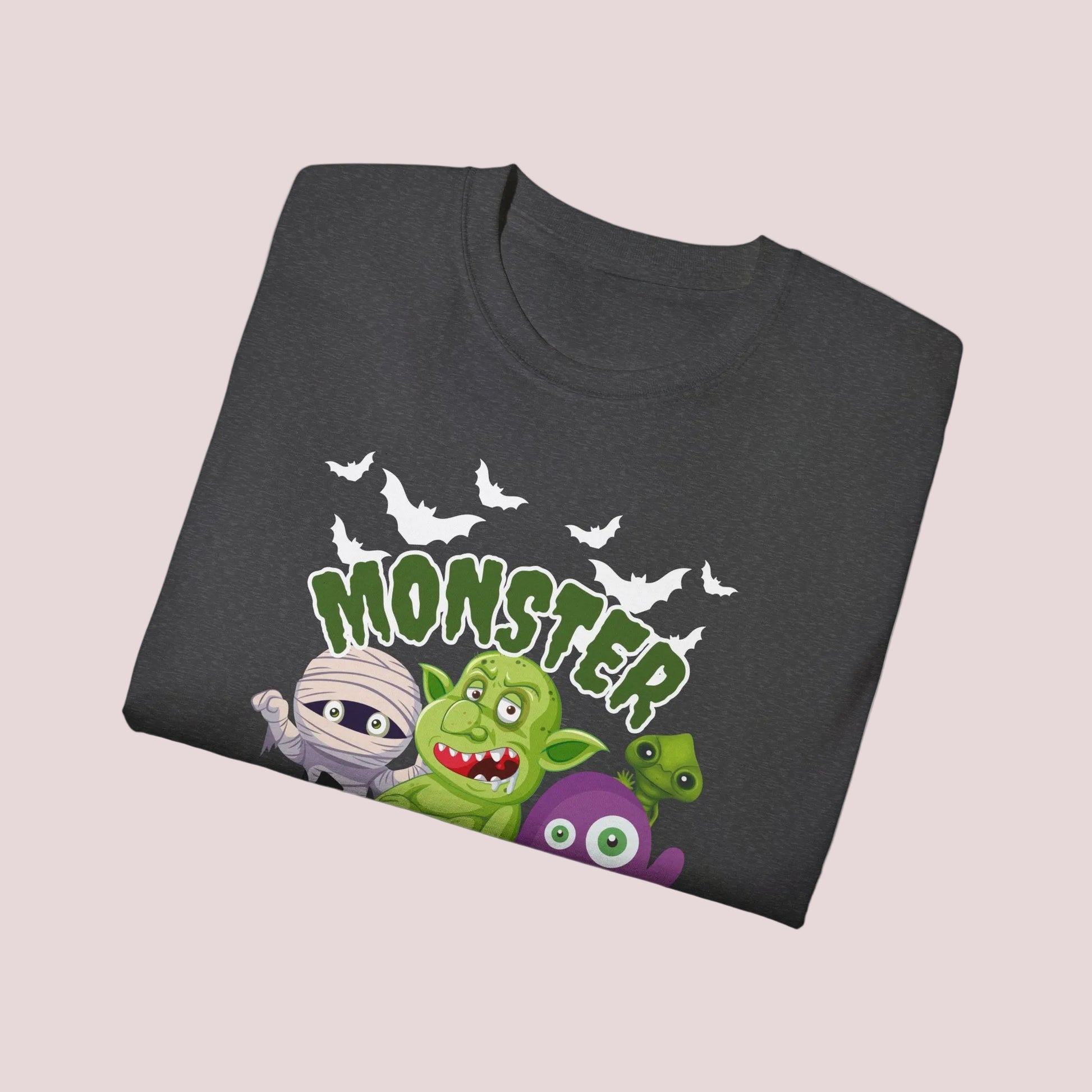 Monster Mash adult Halloween shirt with playful spooky cartoon design featuring bats, trolls, pumpkins, mummy and black cat on black or dark heather cotton tee. Green slime lettering adds bold Halloween style. Unisex sizes S through 5XL. Great gift for Halloween fans, October birthdays, party hosts, teachers, moms and dads. Cute spooky season shirt for casual fall outfits, pumpkin patch trips, fun holiday events.