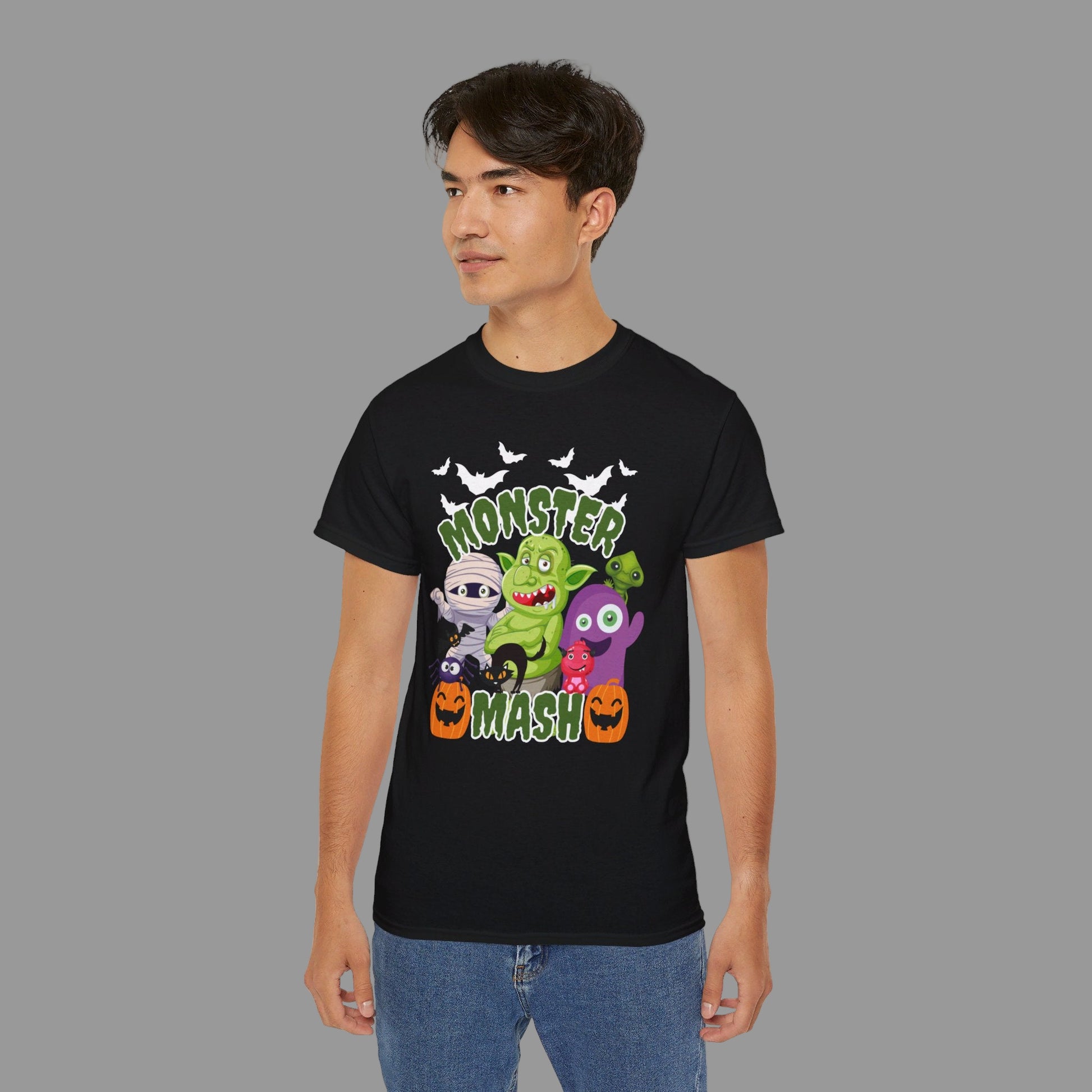 Monster Mash Adult Unisex Halloween Shirt, featuring a mash up of lots of cute Halloween family friendly cartoon monsters, including a mummy, spider, black cat, 2 friendly pumpkins, a troll and lots of bats, by jaecrece.com