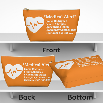 An orange medical alert pouch shown from multiple angles on white shelves, with front, back, and bottom views. The pouch has a white heart outline with a heartbeat line and printed emergency contact text.