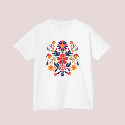 Celebrate color and culture with this Otomi floral girls’ tee in sizes XS to XL. Inspired by Mexican folk art, the bold botanical print adds fun and flair to any outfit. This comfy midweight cotton T-shirt is great for girls’ everyday wear, school looks, family events, or fiesta celebrations. A perfect choice for boho kids fashion, Latinx pride outfits, and traditional Mexican style tops for tweens and children.