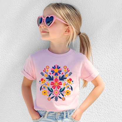 This Otomi Folk Art Girls’ T-shirt features bright florals inspired by Mexican embroidery, printed on soft 100% US cotton. Available in sizes XS–XL, this youth cotton tee offers a classic fit and timeless crew neckline. Great for school, summer playdates, and festive occasions. A perfect gift for girls who love colorful tops, traditional patterns, or cultural kids fashion with a playful folk art aesthetic.