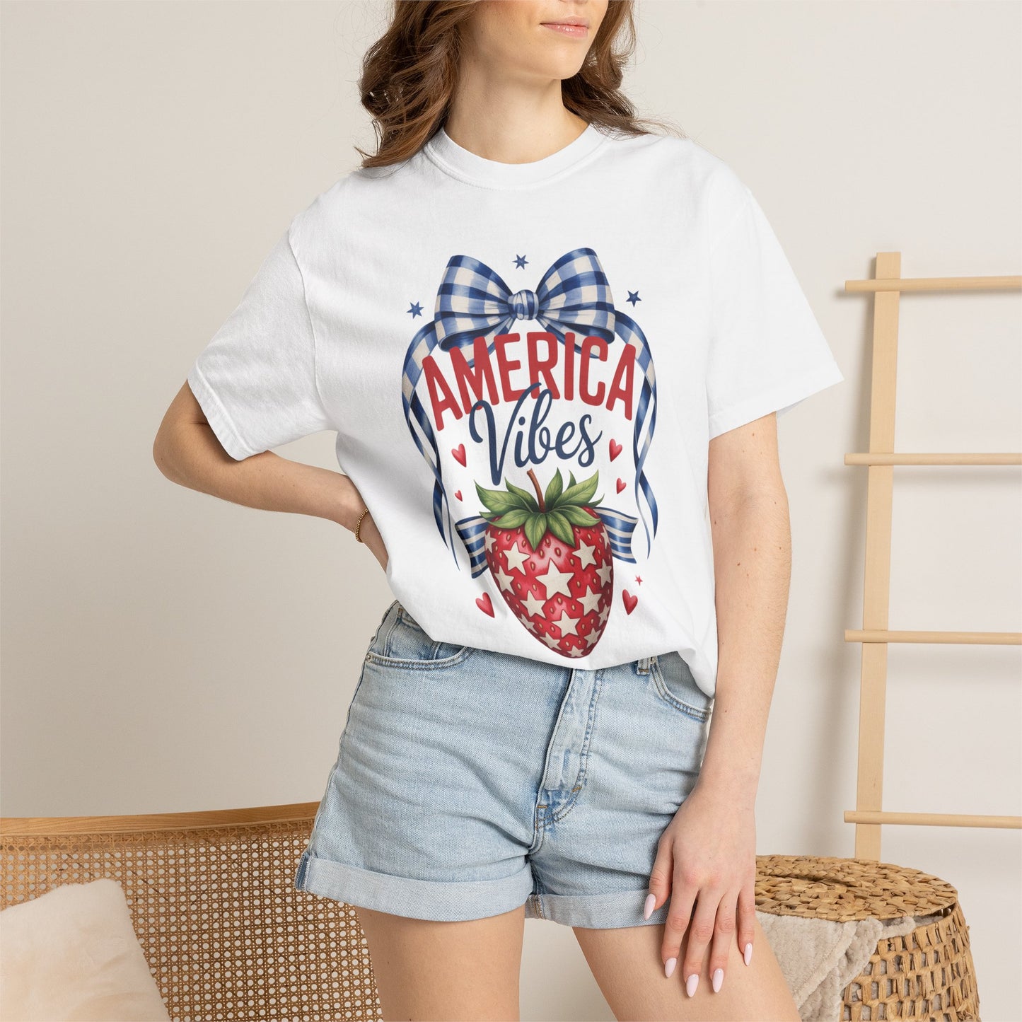 Patriotic strawberry Comfort Colors tee in garment dyed cotton featuring a vintage Americana design with strawberry artwork stars heart details and a gingham bow. America 250 inspired 4th of July shirt with relaxed unisex fit for women. Perfect for mommy and me matching outfits patriotic summer vacations Memorial Day family gatherings and red white and blue holiday celebrations with nostalgic small town style