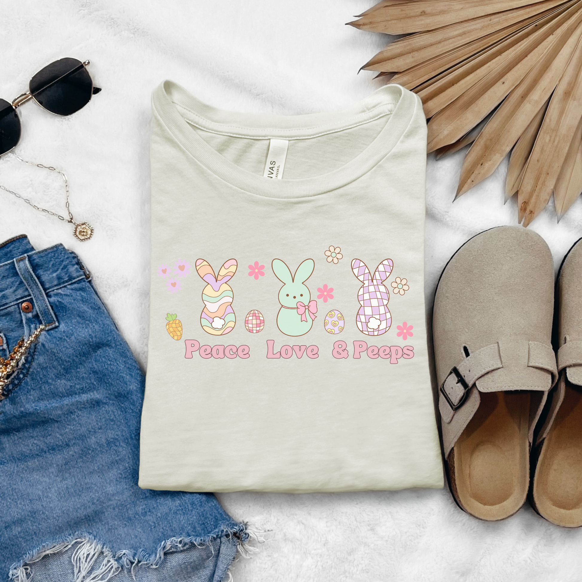 Image: Peace Love and Peeps Easter Shirt for Adults and Children. This Mommy and Me Match Easter Tee features Peeps Easter Candy with Easter Eggs and Daisies. A great Easter shirt for your family holiday celebrations, by jaecrece