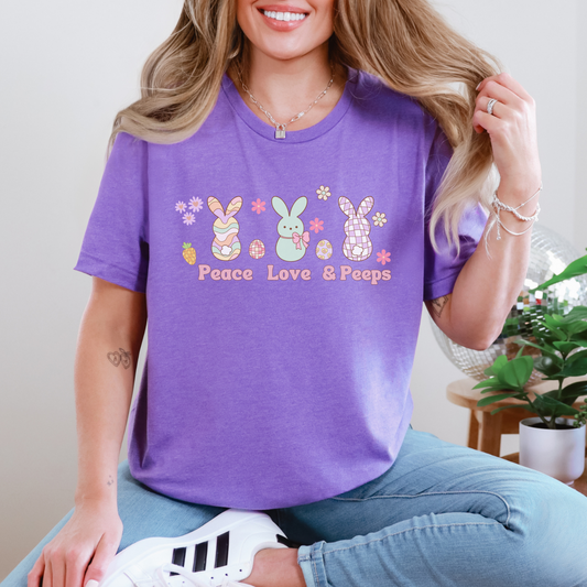 Image: Peace Love and Peeps Easter Shirt for Adults and Children. This Mommy and Me Match Easter Tee features Peeps Easter Candy with Easter Eggs and Daisies. A great Easter shirt for your family holiday celebrations, by jaecrece