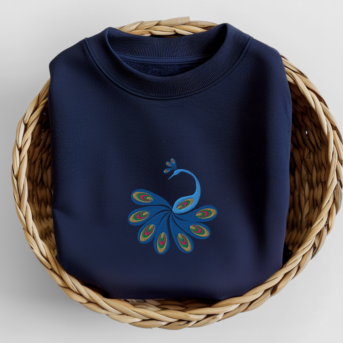 Image: This cozy women’s sweatshirt showcases a hand-embroidered peacock with bright, expressive feathers, blending comfort with charm. Whether paired with jeans or leggings, this top is a bold yet wearable piece that reflects personality and love for wildlife. An excellent wardrobe addition for those who embrace vibrant design and meaningful fashion, by jaecrece.