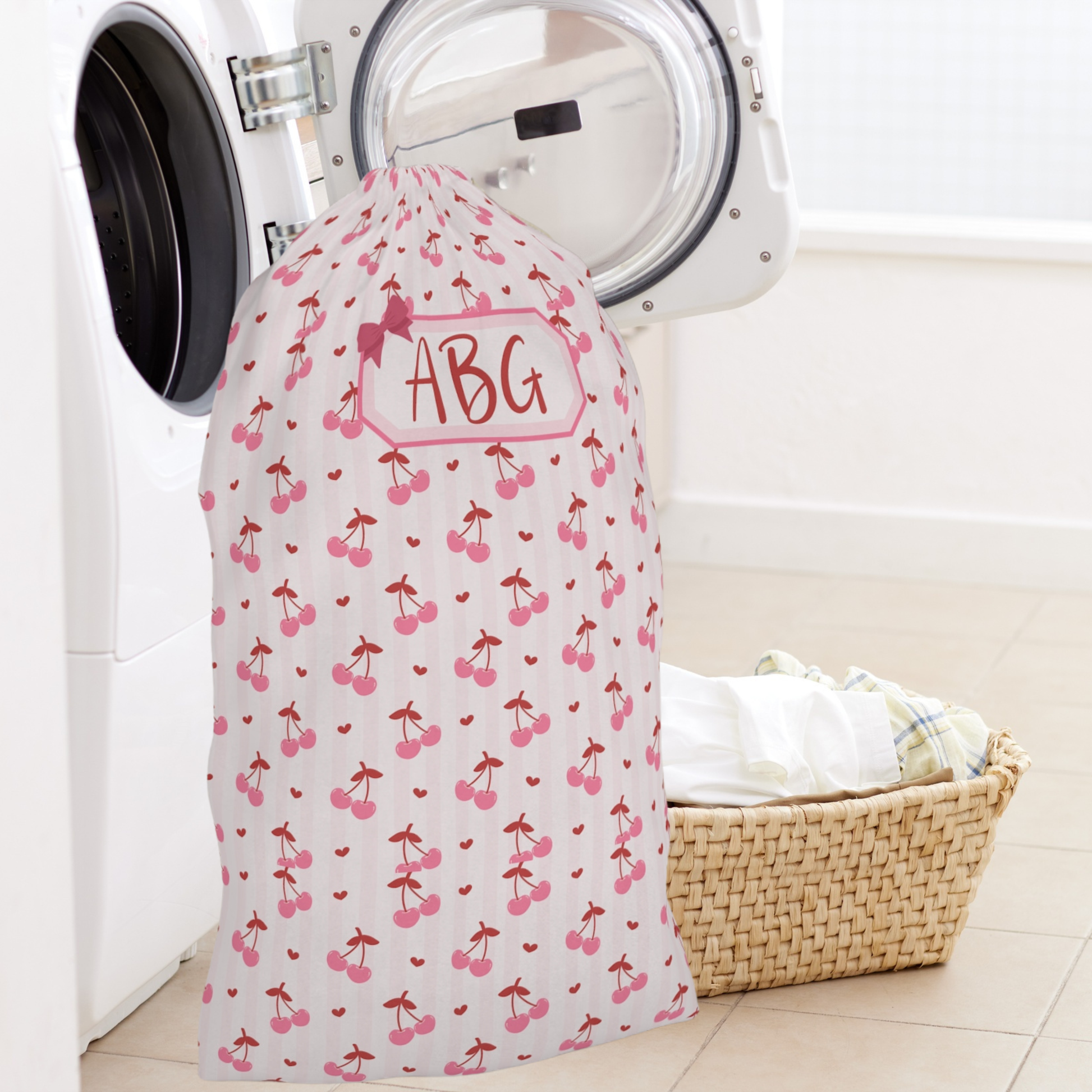 Personalized laundry bag with a sweet coquette cherry design and custom name personalization, offering a stylish solution for organizing clothes at home or on the go. The roomy drawstring construction easily accommodates a full load of laundry, making it perfect for college move in, summer camp, boarding school, sleepovers, and vacations. This charming laundry sack blends everyday function with a soft feminine aesthetic and makes a beautiful personalized gift for all ages.