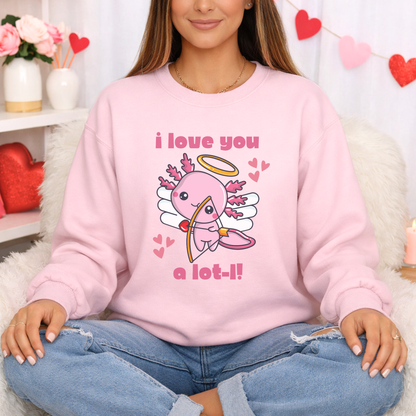 A woman wearing a light pink crewneck sweatshirt with a cute cartoon cupid graphic and the text 'i love you a lot-!'. She is sitting cross-legged on a white faux fur rug in a decorated room with Valentine's Day props. Pink Valentine sweatshirt with a cute axolotl cupid graphic and funny I love you a lotl message. Adorable axolotl gift idea for animal lovers, Valentine’s Day outfits, Galentine’s celebrations, teachers, friends, teens, and adults.