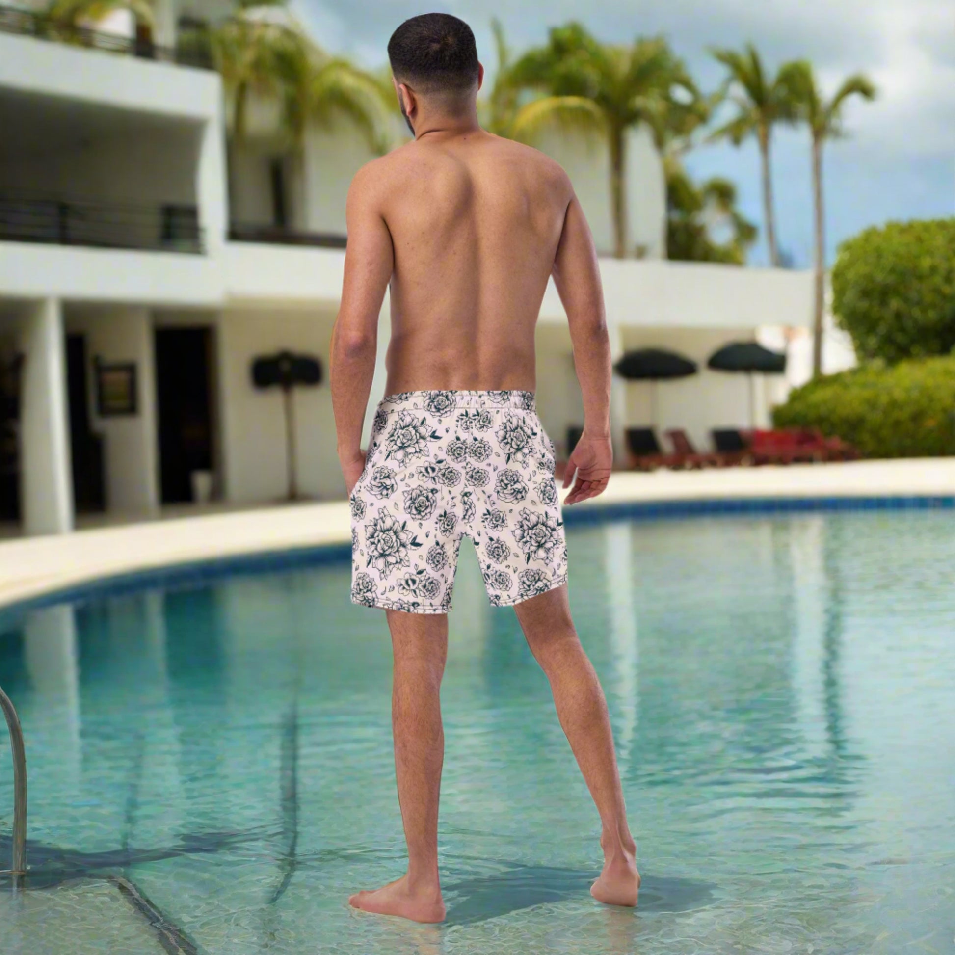 Sustainable and stylish, these Pink Tattoo Roses Men’s Swim Trunks combine comfort, edge, and eco-conscious design. With bold black rose artwork and a vibrant pink base, they're made from recycled polyester with UPF 50+ protection and mesh lining for all-day wear. Great for family matching beach outfits, vacations, or poolside fun. Show off your bold side in these breathable, functional men’s swim shorts designed for lasting summer memories.