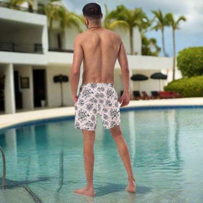 Sustainable and stylish, these Pink Tattoo Roses Men’s Swim Trunks combine comfort, edge, and eco-conscious design. With bold black rose artwork and a vibrant pink base, they're made from recycled polyester with UPF 50+ protection and mesh lining for all-day wear. Great for family matching beach outfits, vacations, or poolside fun. Show off your bold side in these breathable, functional men’s swim shorts designed for lasting summer memories.