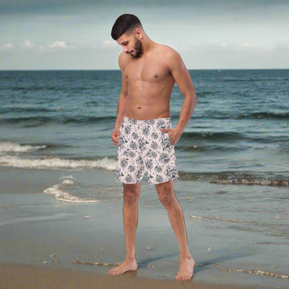 Make waves in our Pink Tattoo Roses Men’s Swim Trunks, featuring a black tattoo rose pattern on bold pink fabric. Made from 91% recycled polyester and built for comfort with an anti-chafe liner, mesh pockets, and UPF 50+ sun protection. These stylish and sustainable trunks are perfect for beach days, summer vacations, or matching family outfits. A must-have for dads and guys who want to combine bold fashion with eco-friendly swimwear.


