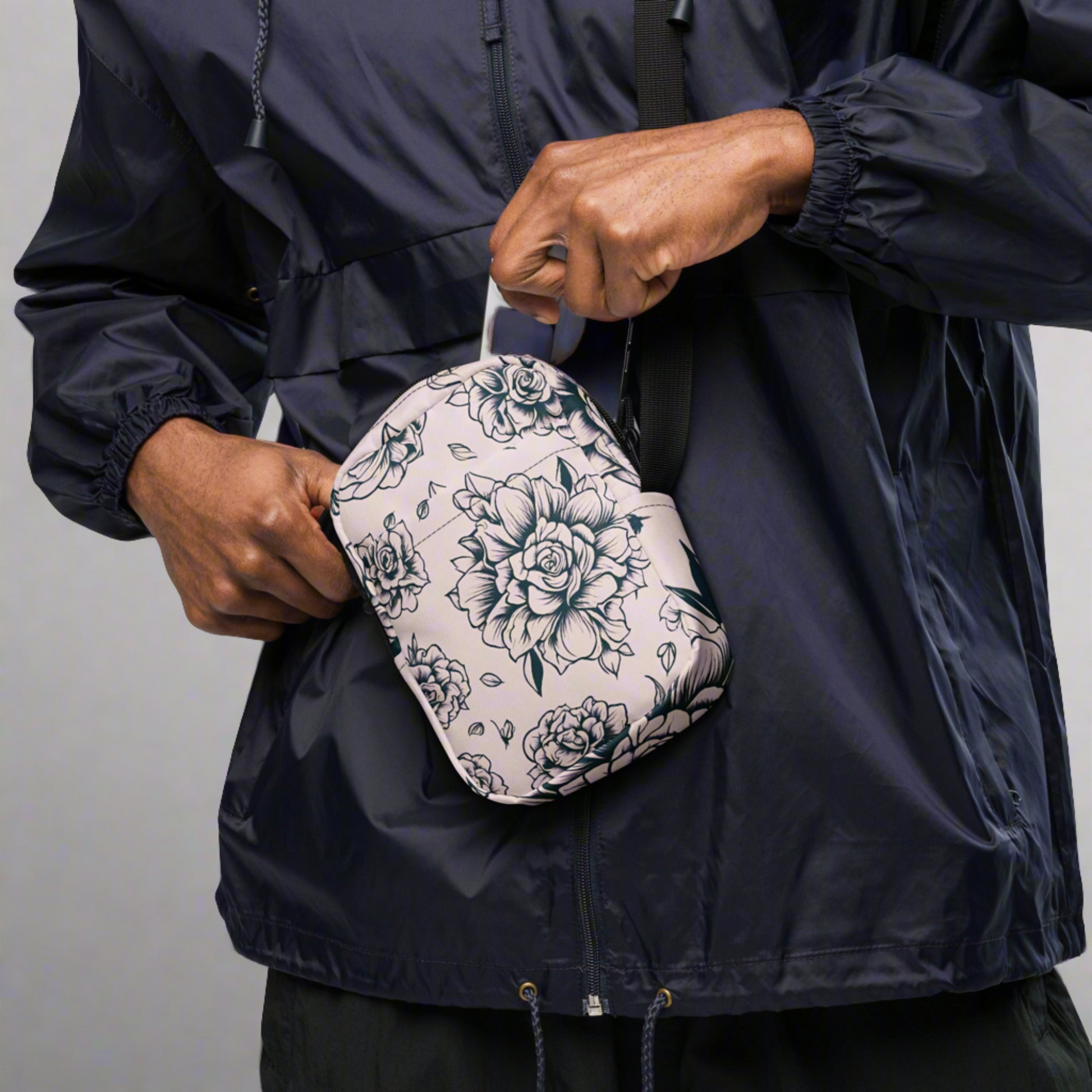 Gothic-inspired tattoo rose crossbody utility bag in pink, offering the perfect balance of edgy style and organization. This durable, water-resistant bag includes structured fusible backing, an adjustable strap, multiple pockets, and two-way zipper for easy access. Ideal for concerts, daily wear, or travel, this floral crossbody purse adds a bold tattoo print design to your wardrobe while keeping essentials organized.