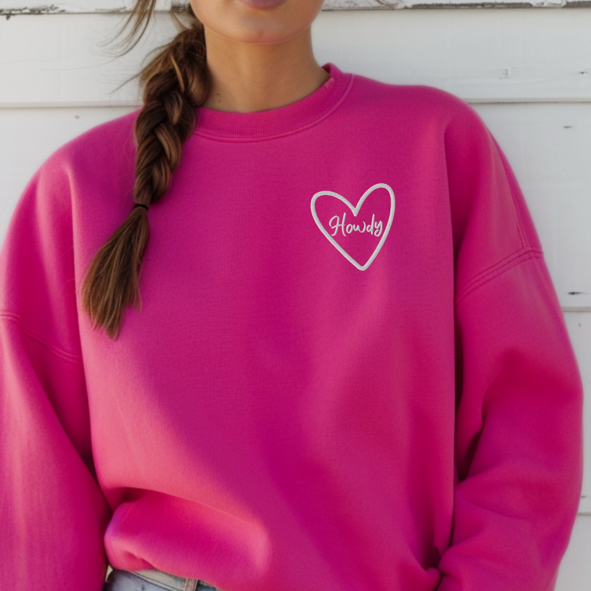 Cozy embroidered Howdy sweatshirt made with Gildan 18000 heavy blend fabric featuring soft fleece interior and durable stitching. Perfect western inspired game day outfit for college football season, tailgates, and campus events. Relaxed unisex fit for everyday comfort. Available in multiple colors including maroon and forest green. Great for Texas sports fans, students, and casual western aesthetic fashion lovers.