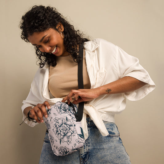 Pink Tattoo Roses Utility Crossbody Bag featuring a bold floral tattoo design on durable polyester fabric, perfect as a small everyday bag, travel utility purse, or festival crossbody. This compact rose print handbag includes multiple compartments, adjustable strap, water-resistant fabric, and two-way zipper for easy organization. Stylish and practical crossbody purse for women who love edgy floral fashion.