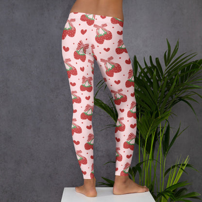 Image: With a light pink base and scattered red bows and strawberries, these women’s leggings bring soft girl and coquette aesthetics to life. Designed in sizes XS to XL, they flatter and stretch with ease, making them perfect for yoga, brunch, or lounging in style. Sweet and whimsical, they’re ideal for women who love fun patterns and feminine flair in their everyday wardrobe, by jaecrece.