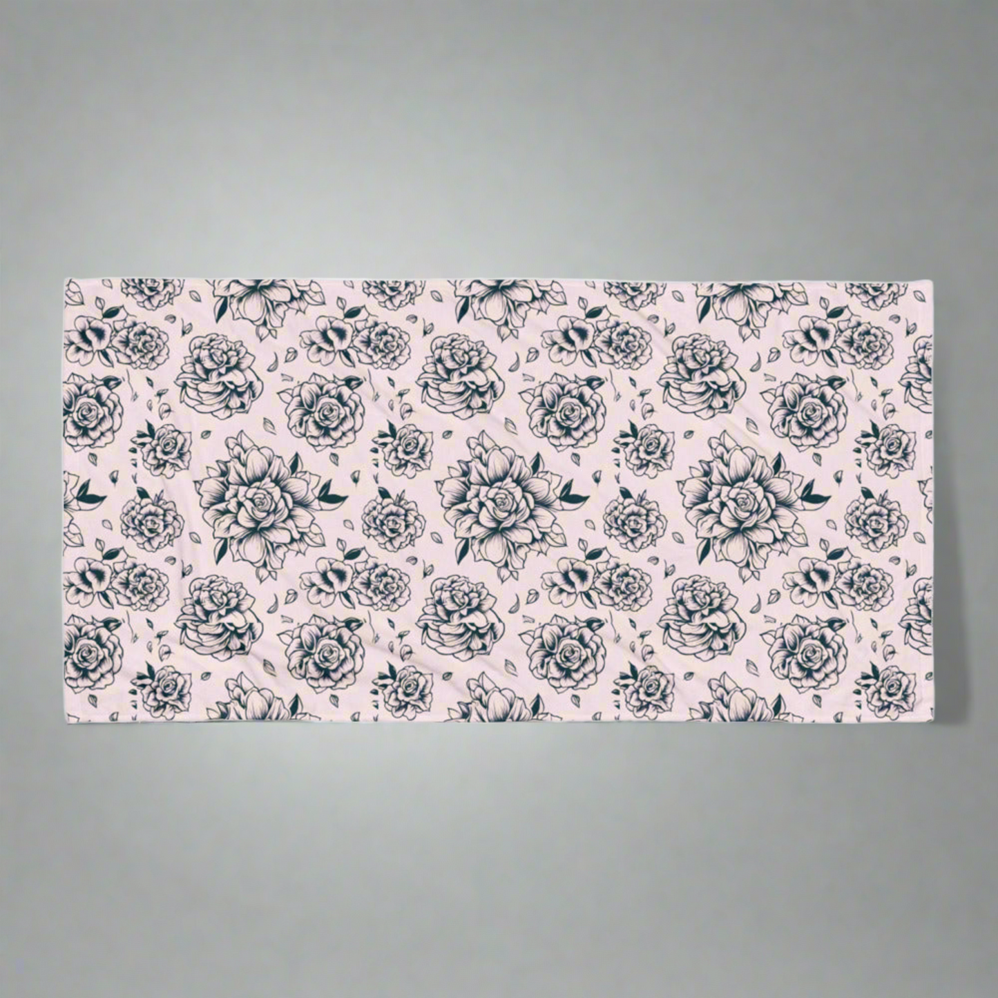 Pink Tattoo Rose Beach Towel flatlay on a neutral background, showing full 30×60″ oversized design with bold black and pink tattoo rose print, soft cotton blend with absorbent terry backing, perfect for pool, beach, lake, or travel use, lightweight and quick-drying, stylish summer accessory, coordinating with matching swimwear, statement floral towel for women, girls, and family, ideal for vacations, pool parties, and everyday lounging.