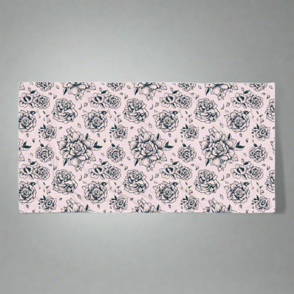 Pink Tattoo Rose Beach Towel flatlay on a neutral background, showing full 30×60″ oversized design with bold black and pink tattoo rose print, soft cotton blend with absorbent terry backing, perfect for pool, beach, lake, or travel use, lightweight and quick-drying, stylish summer accessory, coordinating with matching swimwear, statement floral towel for women, girls, and family, ideal for vacations, pool parties, and everyday lounging.