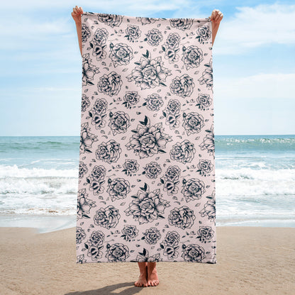 Detailed view of the Pink Tattoo Rose Beach Towel’s black and pink floral tattoo design, showing vibrant bold rose print on soft cotton blend fabric, ideal oversized beach towel for pool, lake, or beach, absorbent terry backing, lightweight and stylish, travel-friendly summer accessory, coordinating with matching swimwear or poolside outfits, statement floral towel for girls, women, and family use.