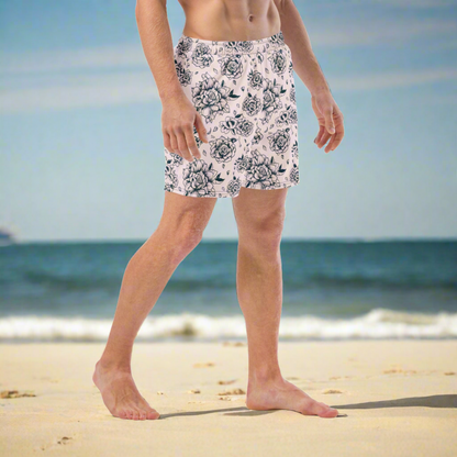 Make a statement with these eco-friendly Pink Tattoo Roses Men’s Swim Trunks made from recycled polyester. Featuring an edgy black rose design, these men's beach shorts are ideal for summer vacations, pool parties, or family matching moments. Breathable fabric, anti-chafe mesh liner, and drawstring waist offer comfort and style. Great for dads who love bold prints and sustainable swimwear for family trips or outdoor adventures.