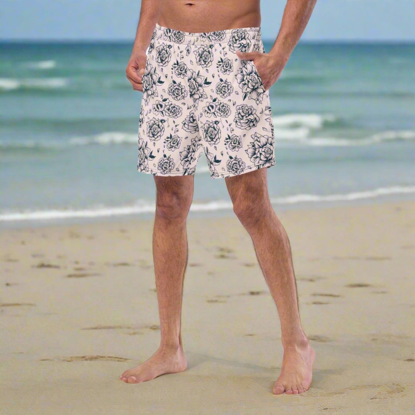 Pink Tattoo Roses Men’s Swim Trunks offer a bold summer look with sustainable roots. Crafted from recycled polyester, these swim shorts feature an edgy tattoo rose design in black on a pink background, perfect for beach vacations or poolside lounging. Includes breathable mesh lining, UPF 50+ protection, and an adjustable drawstring waistband. A standout choice for dads looking to match with the family or rock a one-of-a-kind summer look.